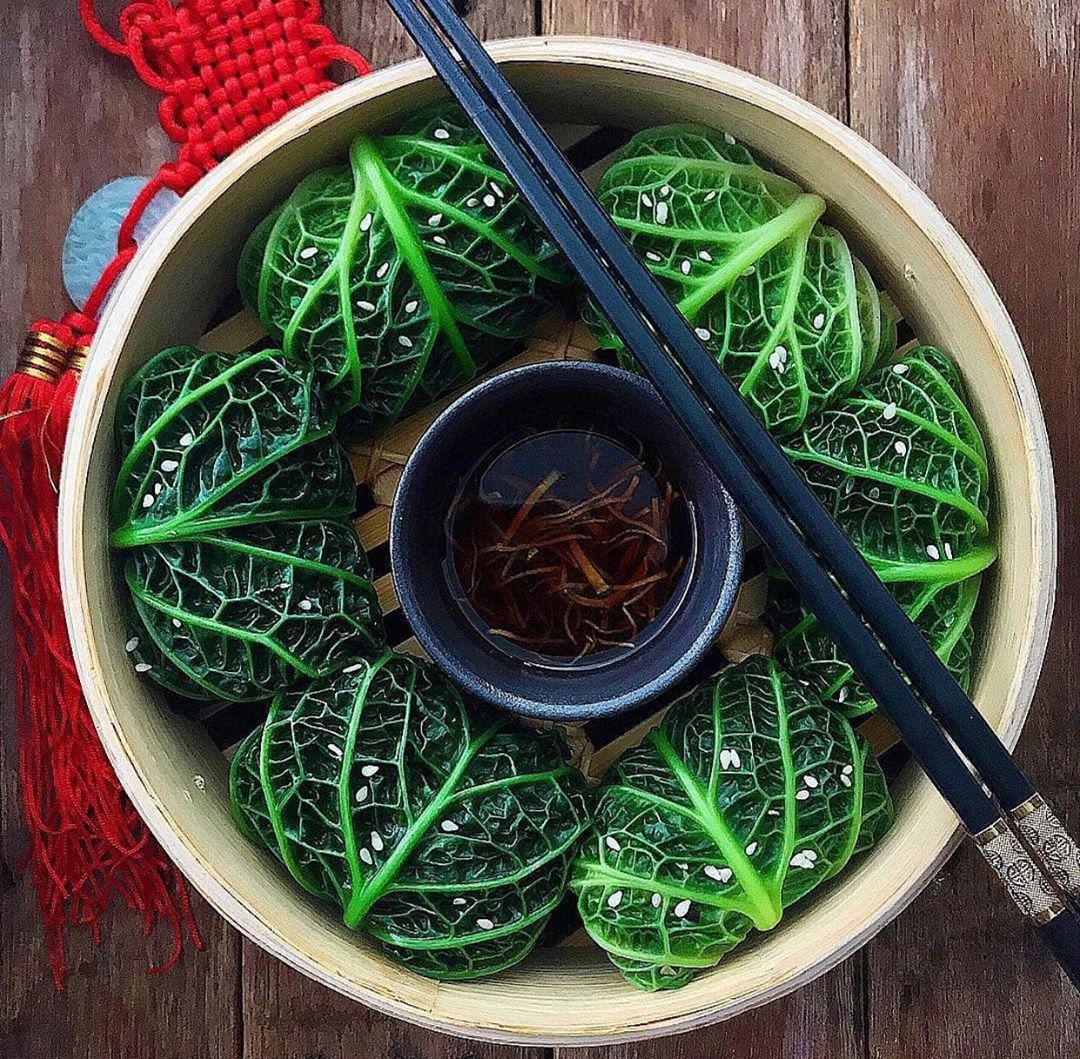 Steamed Cabbage Wraps with Fresh Vegetables and Dipping Sauce