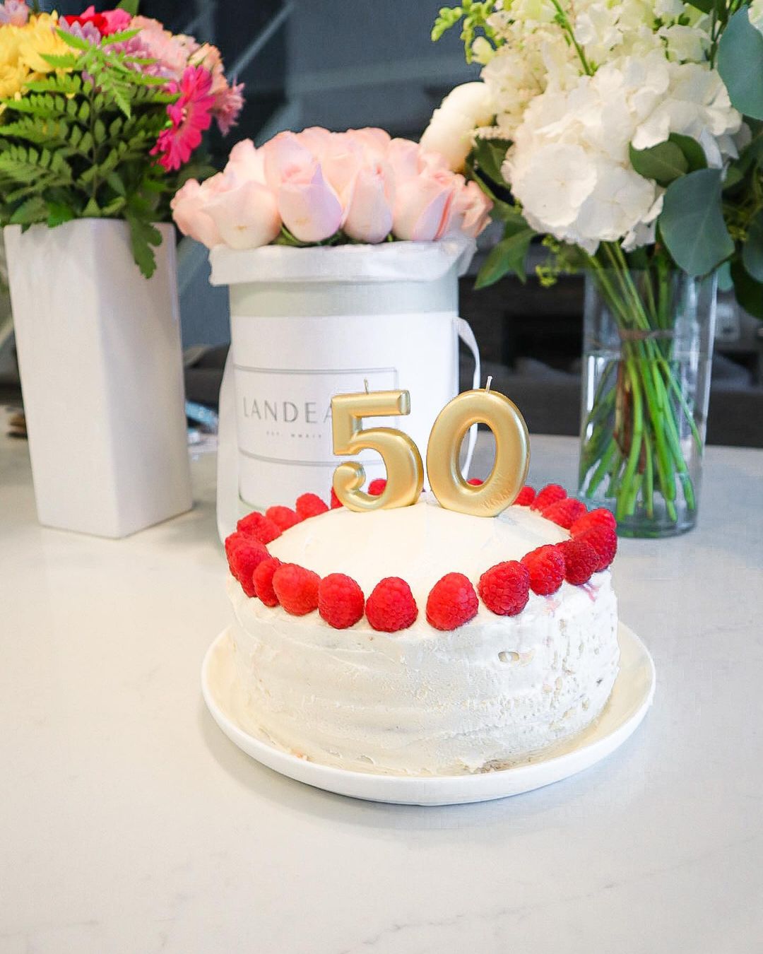 Homemade Vanilla Cake with Frosting and Raspberries