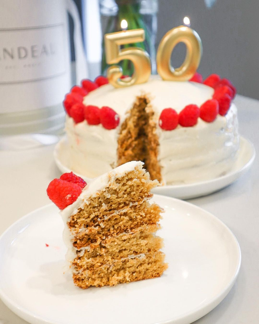 Homemade Vanilla Cake with Frosting and Raspberries
