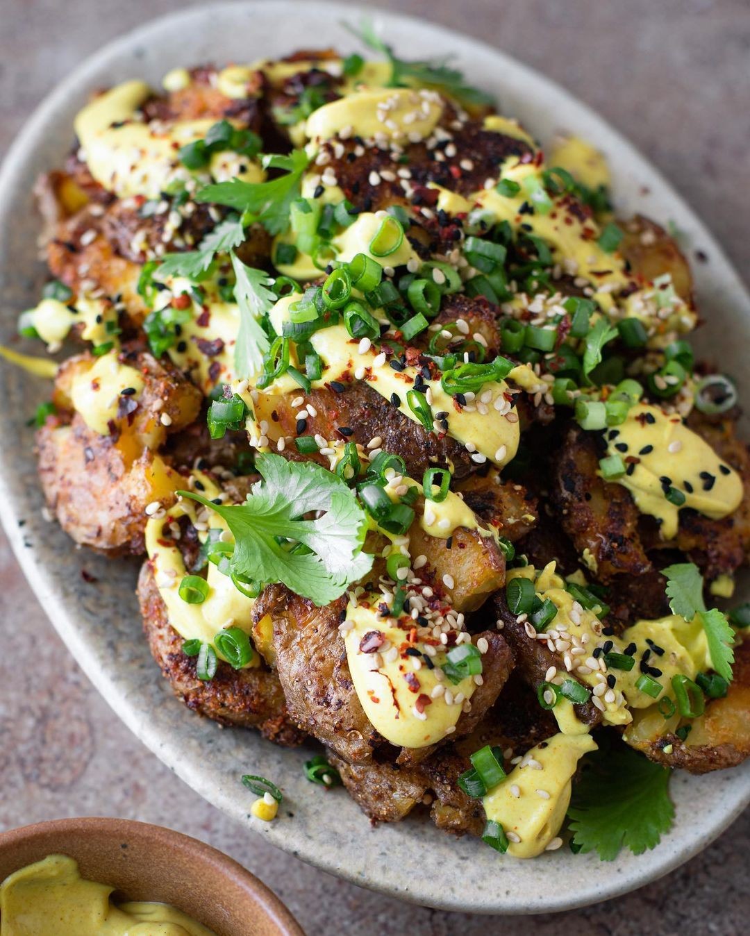 Crispy Smashed New Potatoes with Curry & Tahini Dip