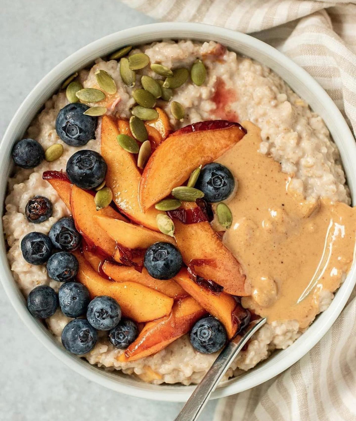 Cinnamon Peach Oatmeal Breakfast Bowl