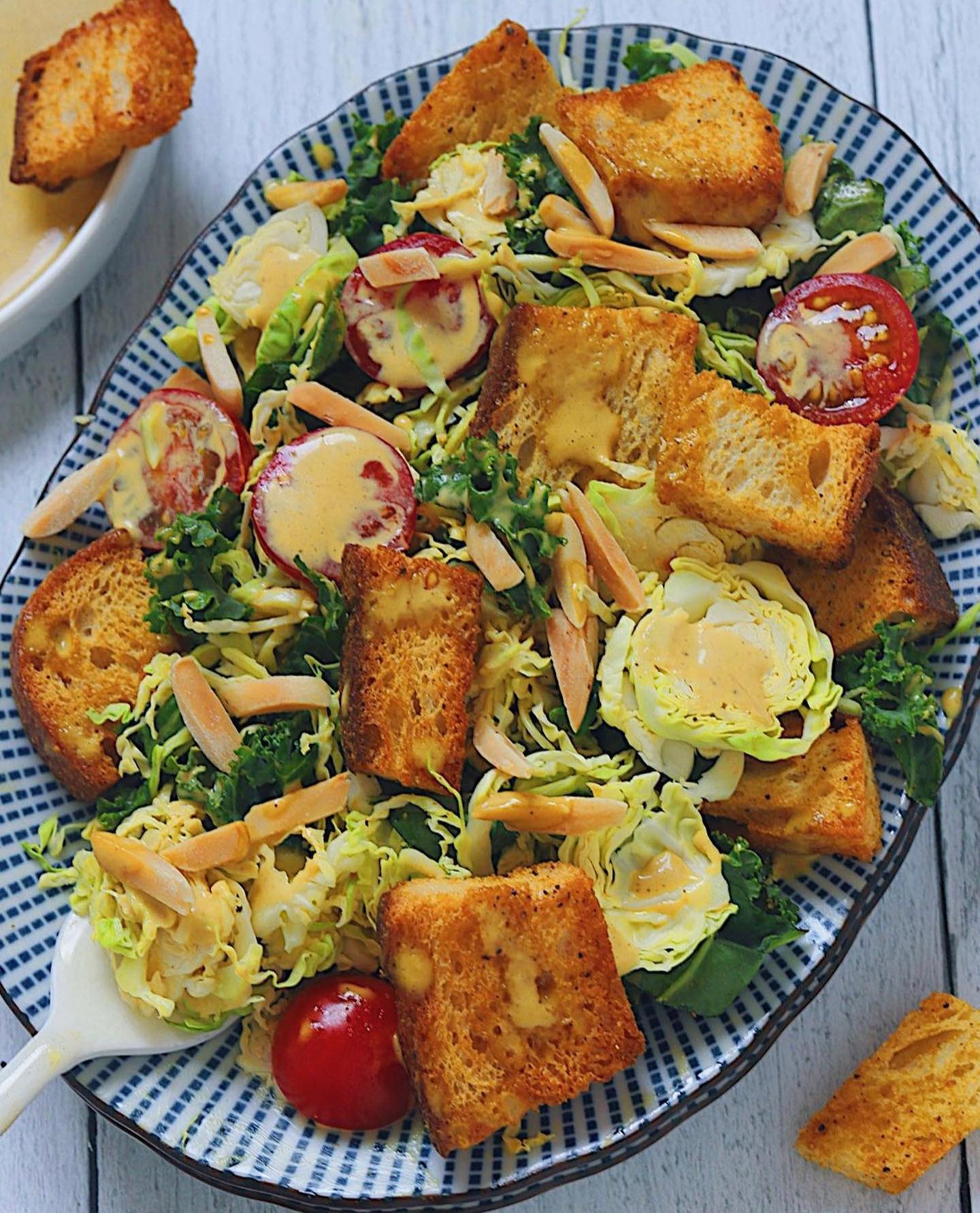 Vegan Kale and Brussel Sprout Caesar Salad with Air-Fried Croutons