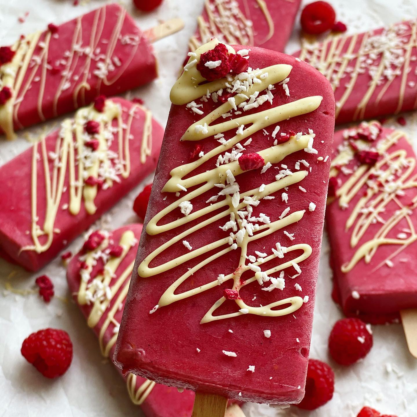 Raspberry and Coconut Ice Lollies with White Chocolate Drizzle
