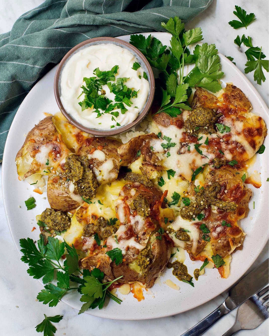 Cheesy Smashed Potatoes with Garlic and Pesto