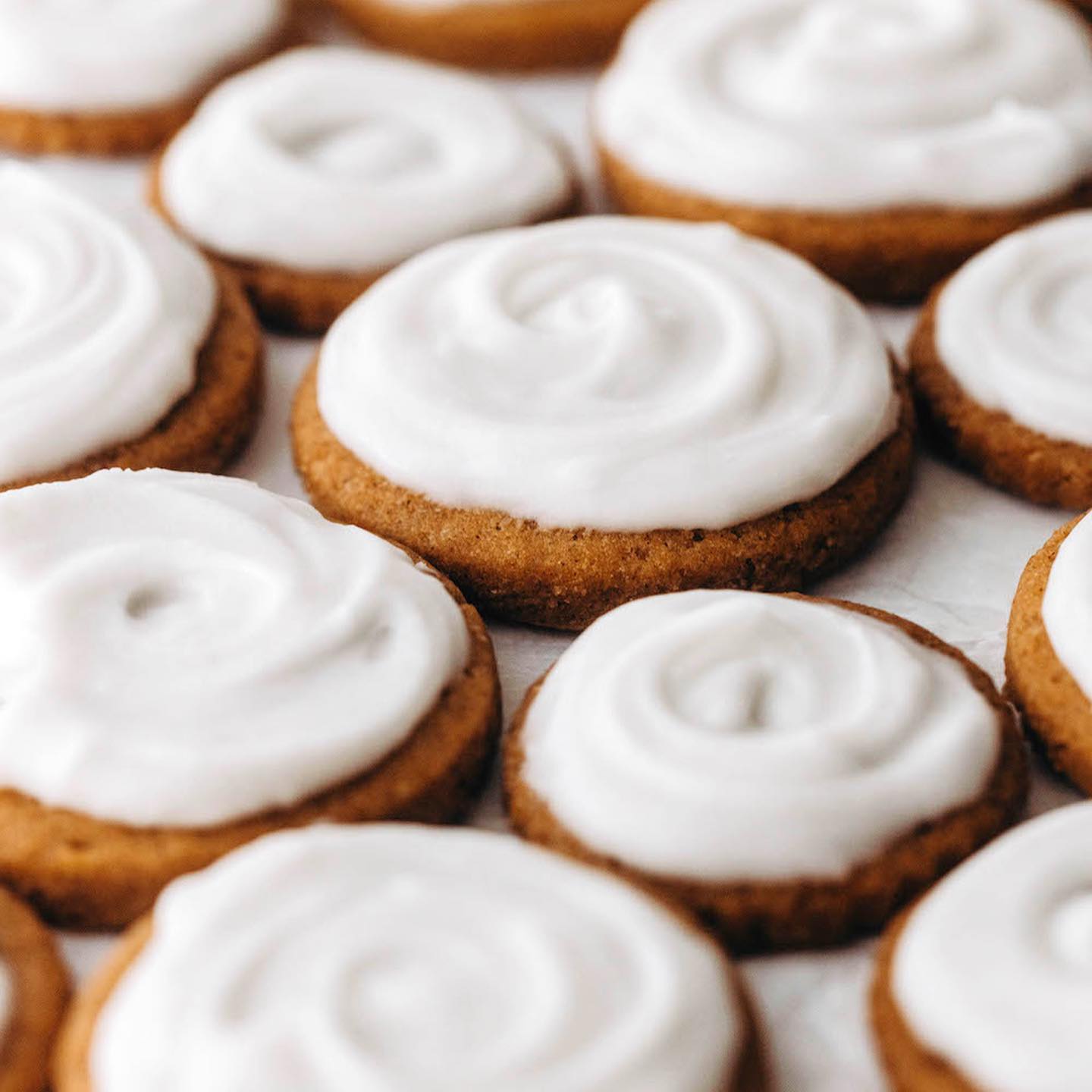 Pumpkin Cutout Cookies with Fluffy Spiced Maple Frosting