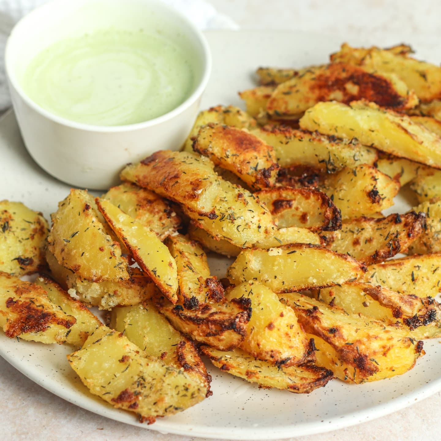 Baked Garlic Thyme Potato Fries with Vegan Avocado Lime Sauce