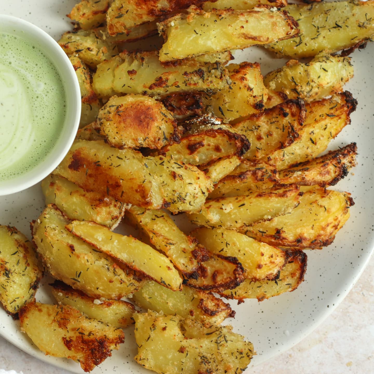 Baked Garlic Thyme Potato Fries with Vegan Avocado Lime Sauce