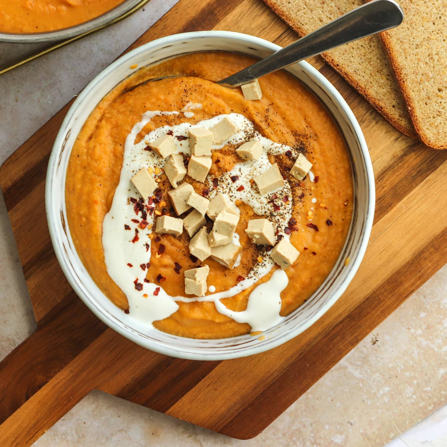 Spicy Red Lentil, Sweet Potato, and Carrot Soup with Tofu and Bread