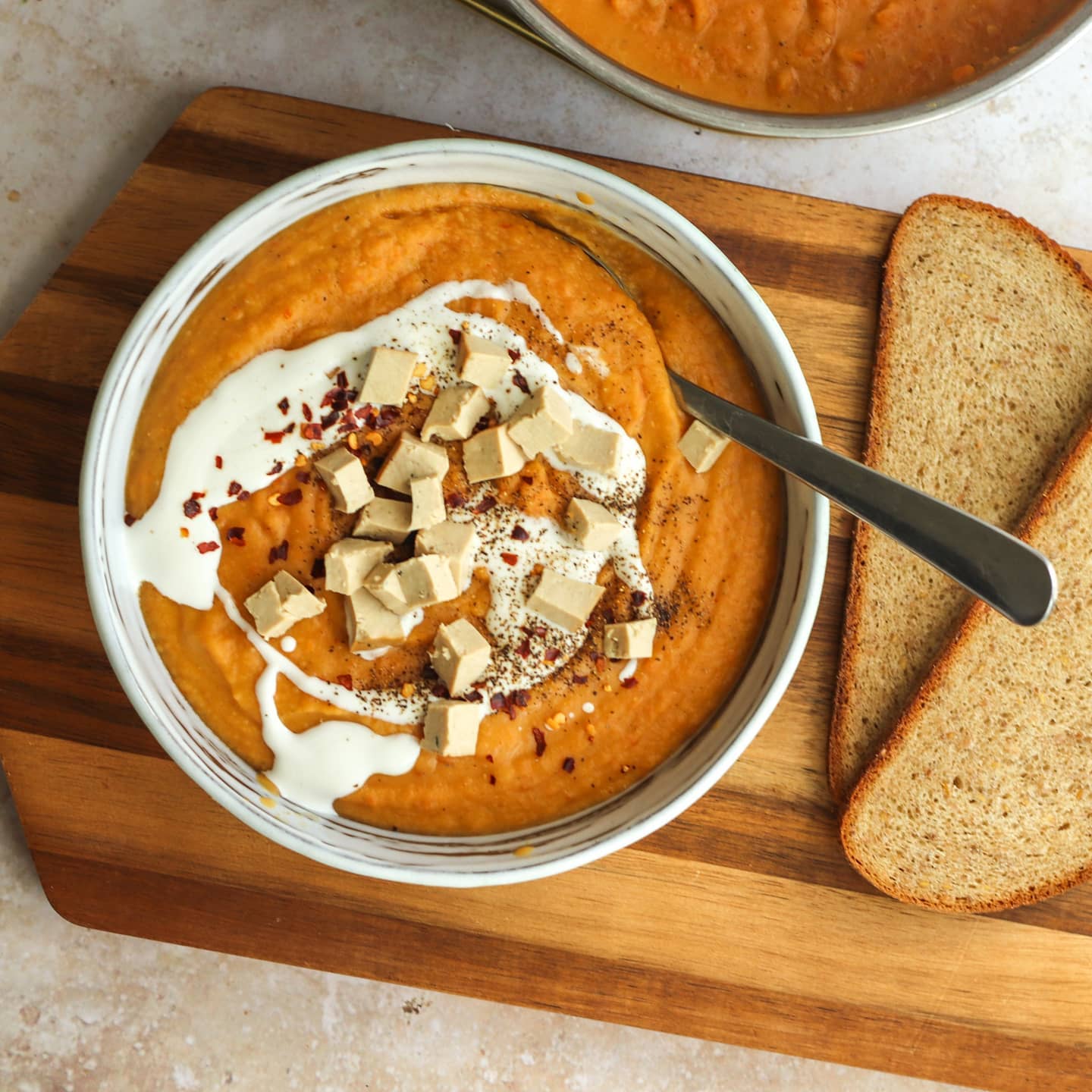 Spicy Red Lentil, Sweet Potato, and Carrot Soup with Tofu and Bread