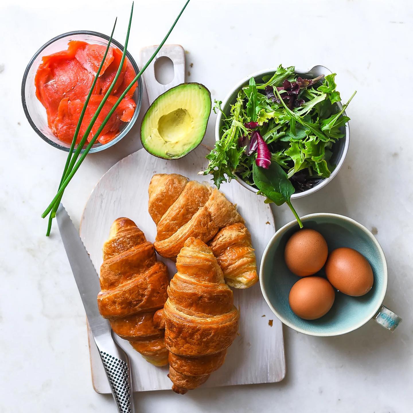 Croissant Breakfast Sandwich with Salmon and Eggs