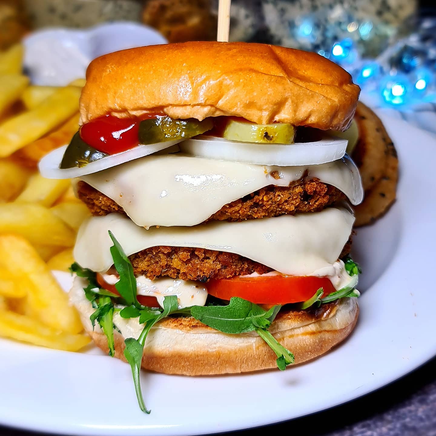 Spicy Bean Burger with Melted Cheese and Sides