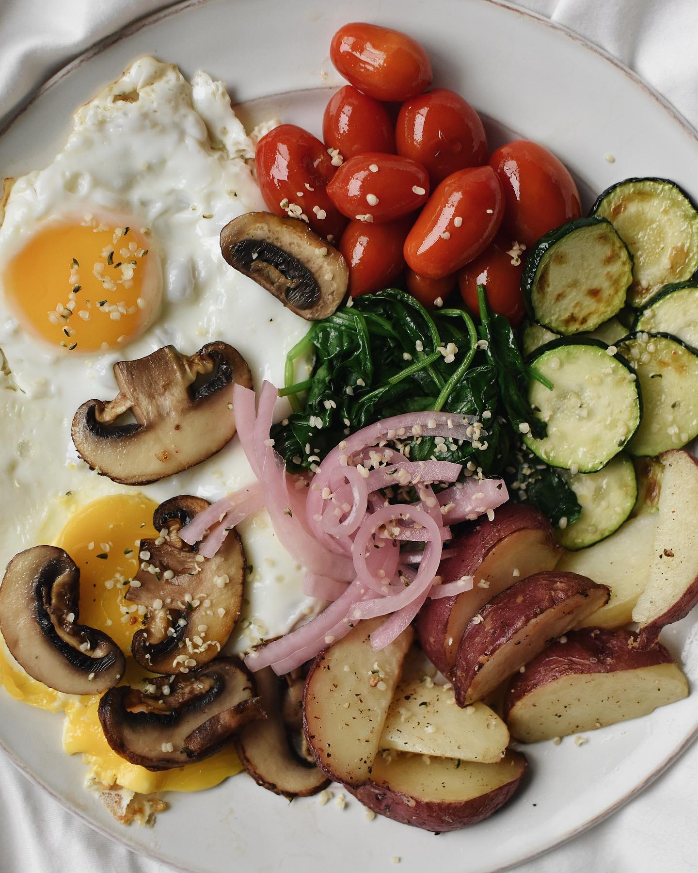 Breakfast Plate with Fried Eggs and Vegetables