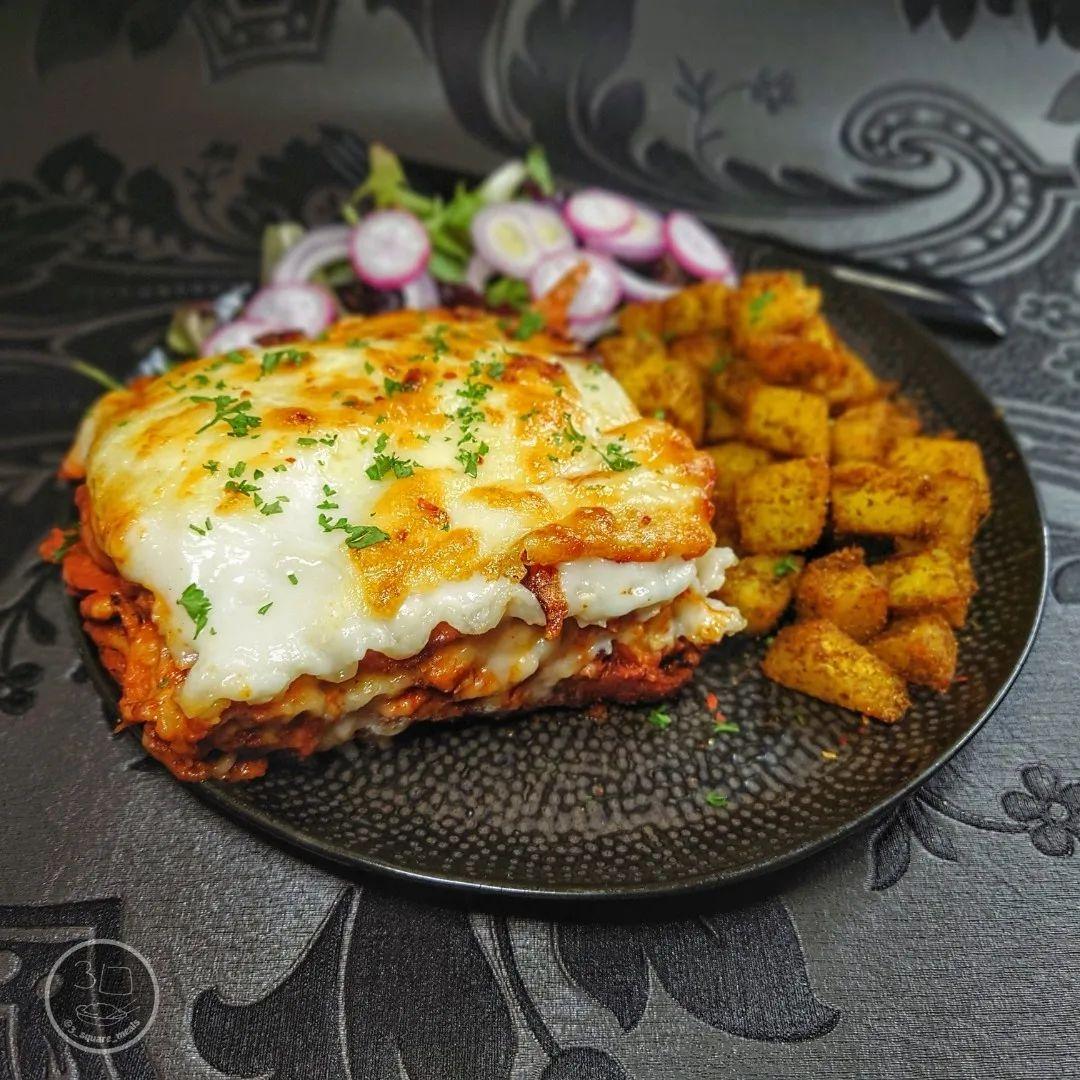 Creamy Tikka Lasagne with Bombay Potatoes