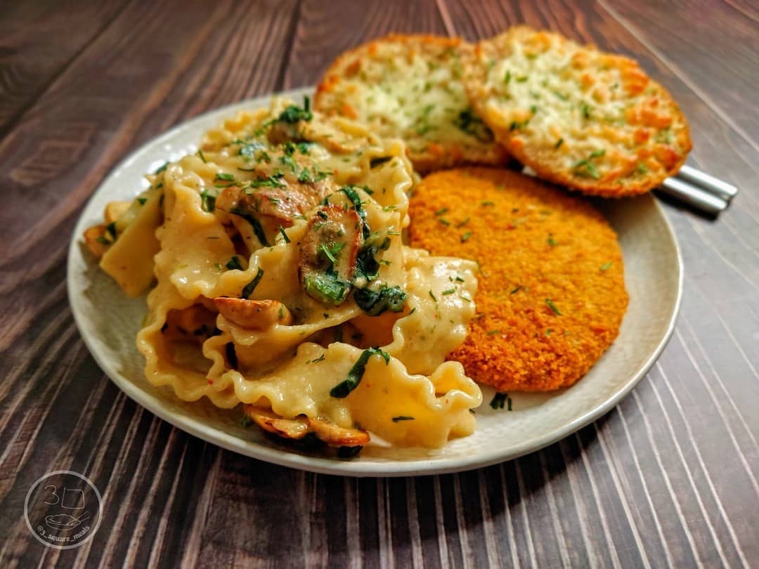 Schnitzel with Mafalde Pasta and Cheesy Garlic Bread