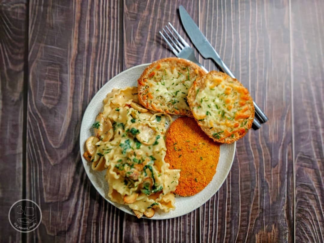 Schnitzel with Mafalde Pasta and Cheesy Garlic Bread