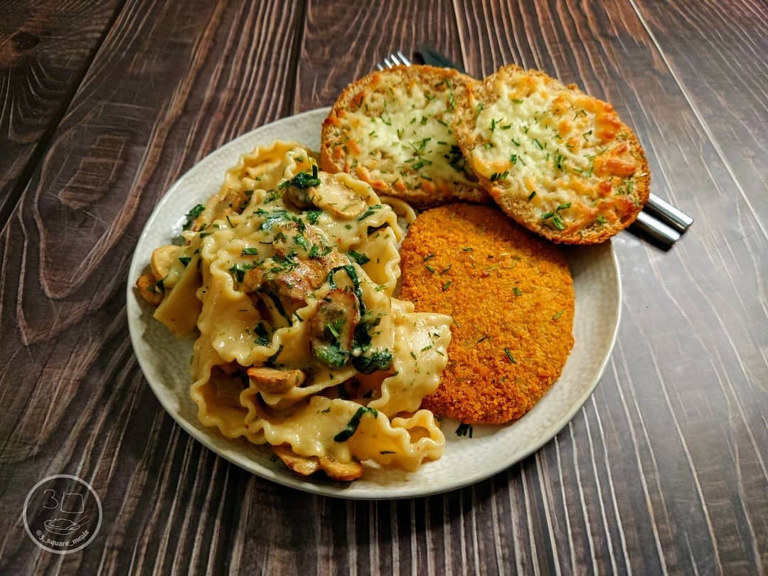 Schnitzel with Mafalde Pasta and Cheesy Garlic Bread
