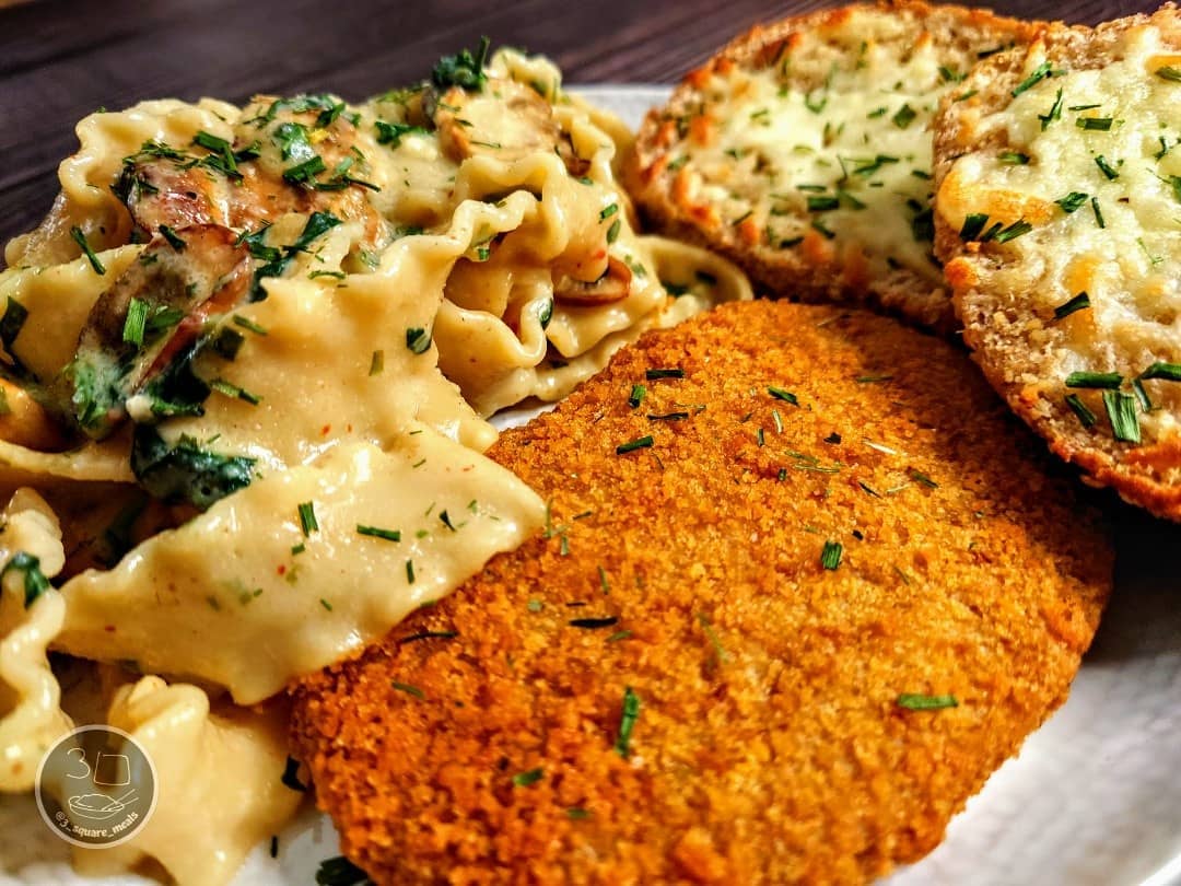 Schnitzel with Mafalde Pasta and Cheesy Garlic Bread