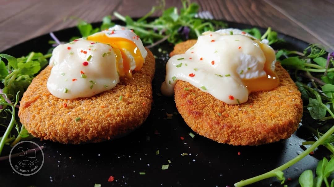 Vegetarian Schnitzel and Poached Eggs Breakfast