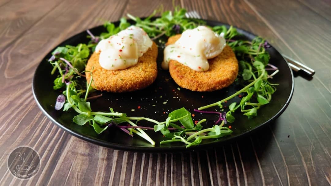 Vegetarian Schnitzel and Poached Eggs Breakfast