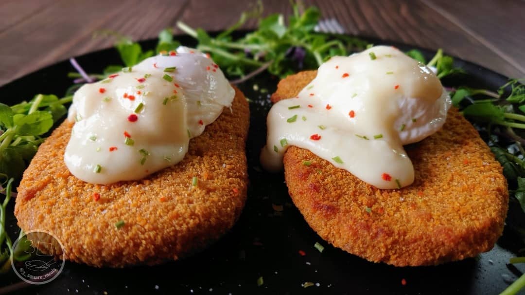 Vegetarian Schnitzel and Poached Eggs Breakfast