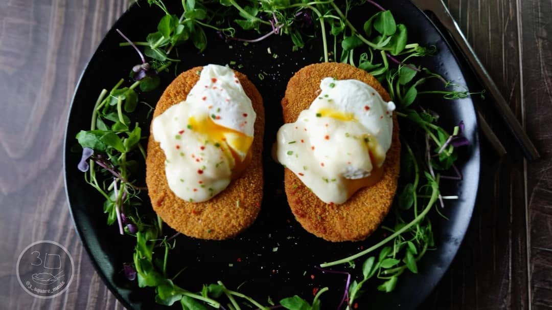 Vegetarian Schnitzel and Poached Eggs Breakfast