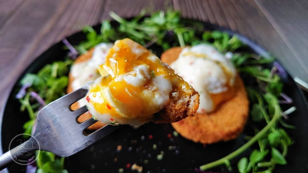Vegetarian Schnitzel and Poached Eggs Breakfast