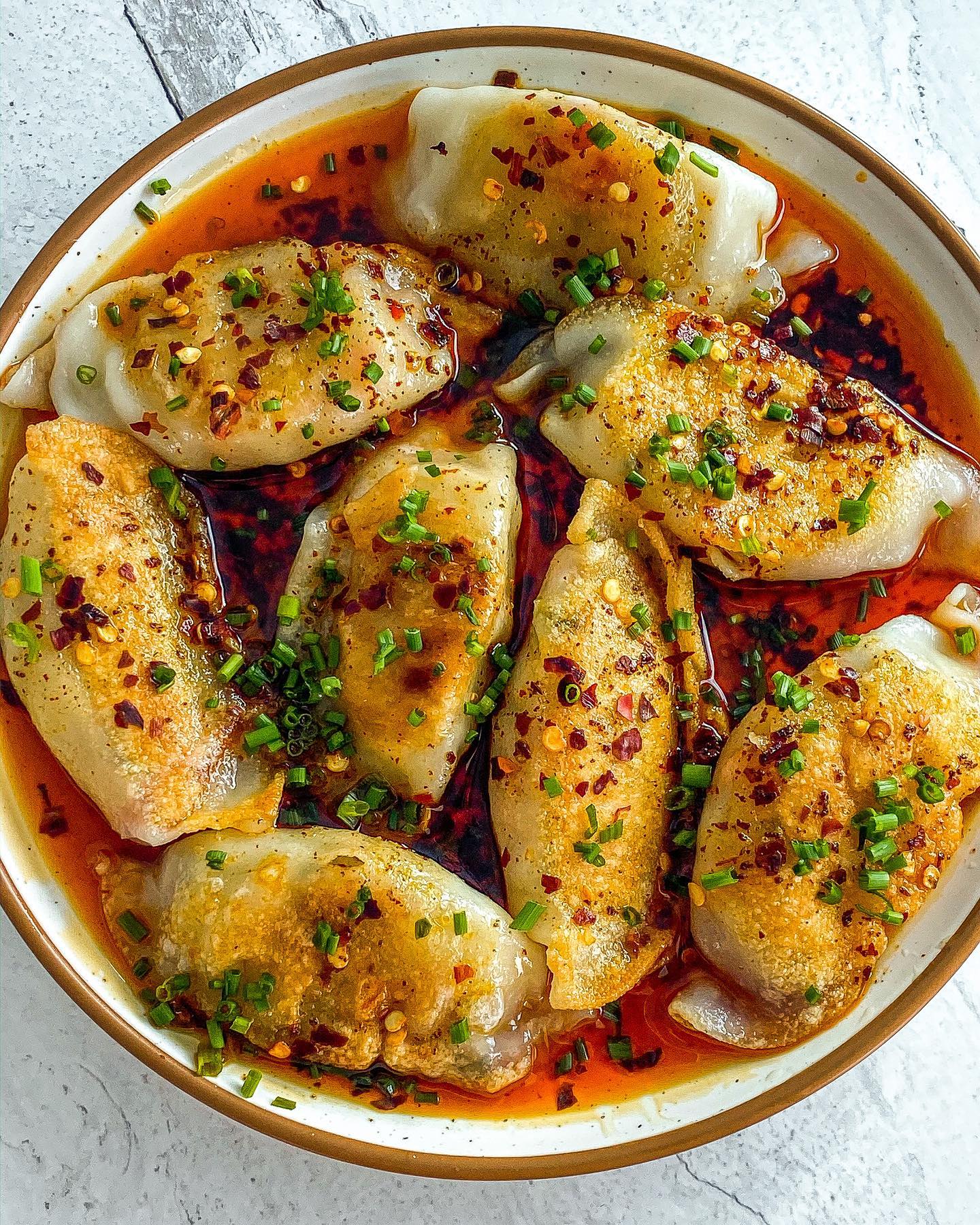 Vegan Gyoza with Mushroom, Tofu, and Carrot, Drizzled with Homemade Chili Oil