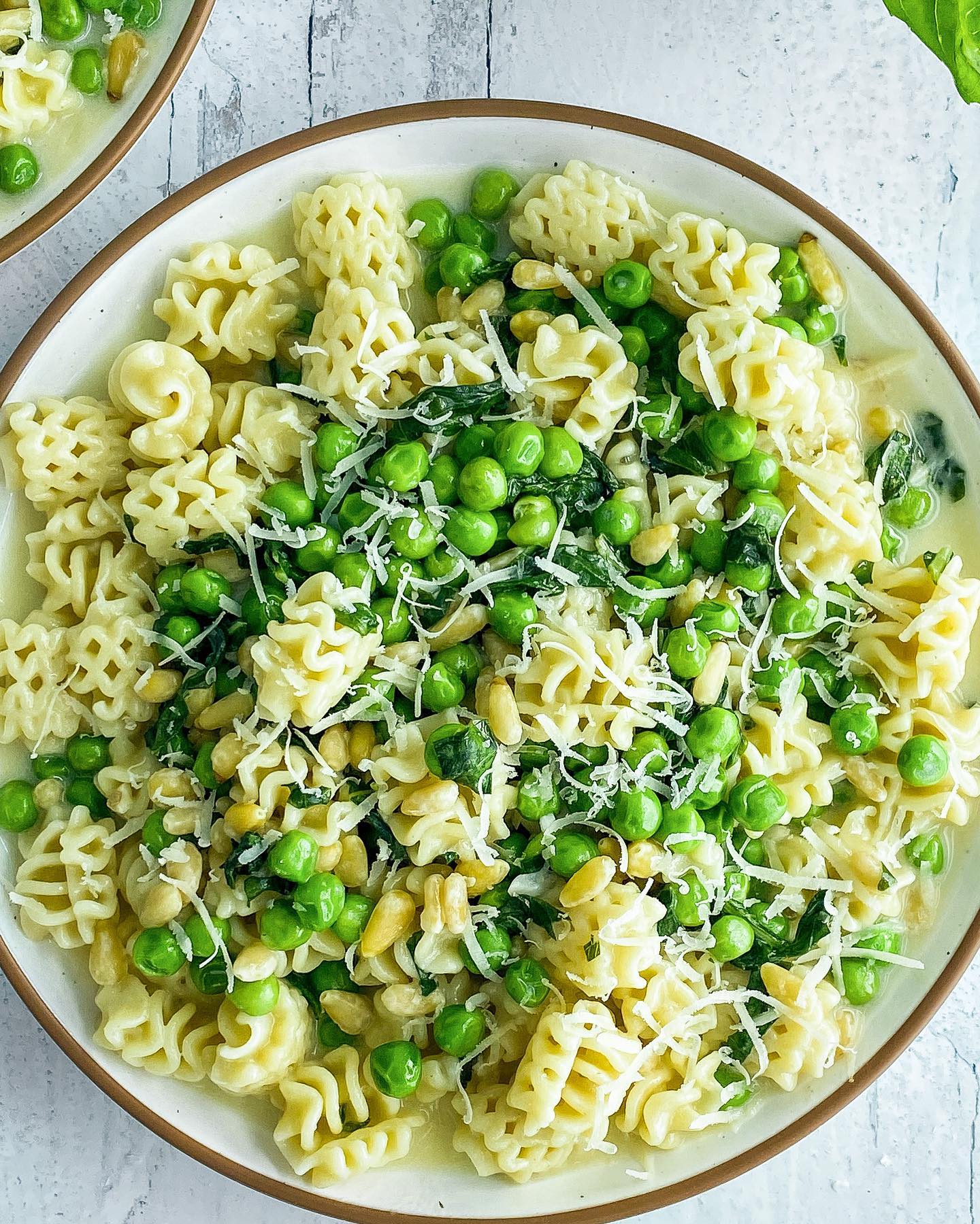 Creamy Vegan Radiatori with Green Peas, Pine Nuts, and Basil