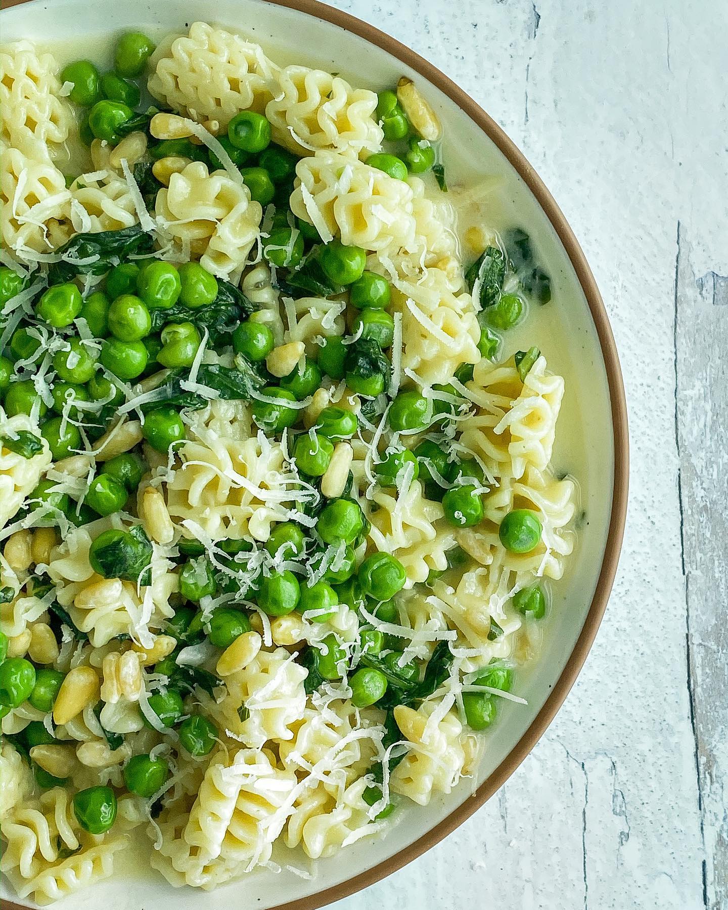 Creamy Vegan Radiatori with Green Peas, Pine Nuts, and Basil