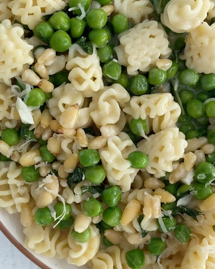 Creamy Vegan Radiatori with Green Peas, Pine Nuts, and Basil