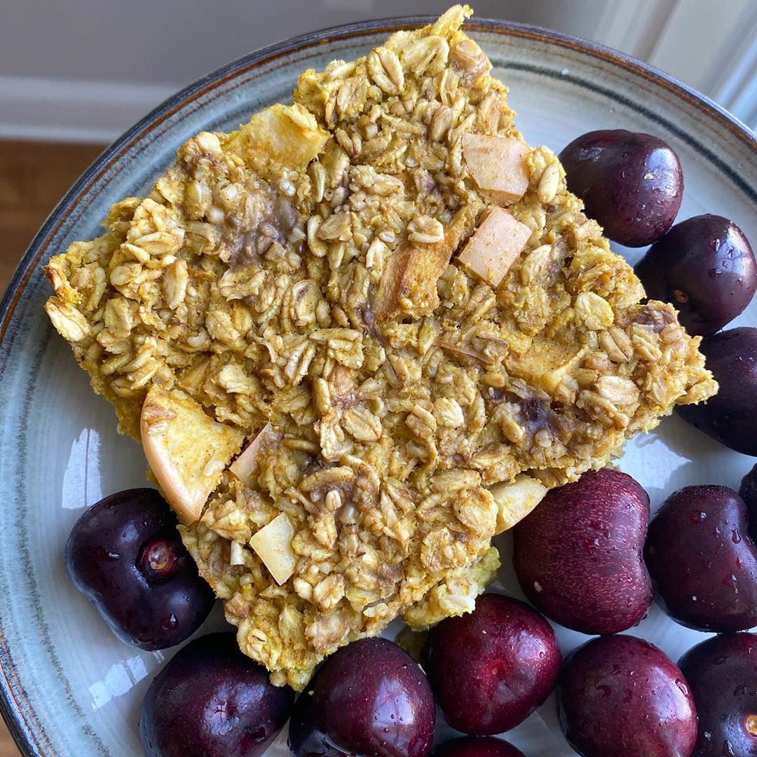 Slice of Apple Turmeric Spice Oat Bake with a Side of Cherries