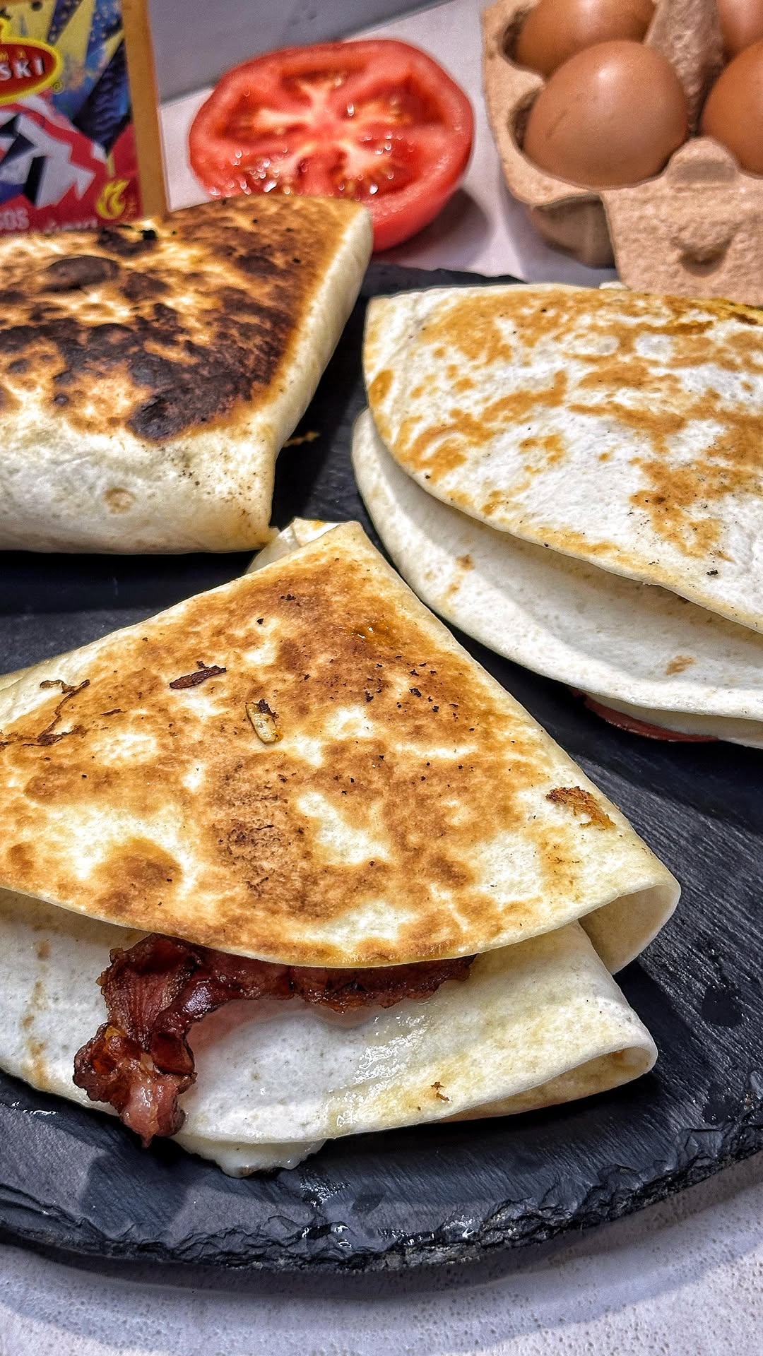 Bacon and Egg Tortilla with Sauce and Tomato