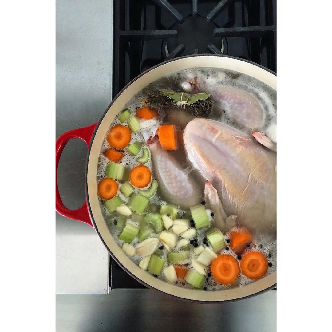 Homemade Chicken Broth with Fresh Vegetables and Herbs