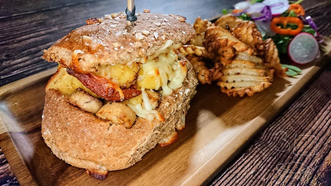Gnocchi and Sausage Stuffed Bun with Chips and Salad