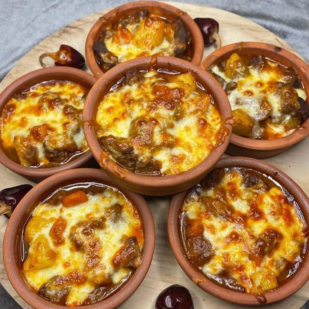 Cheese-Topped Turkish Tas Kebab