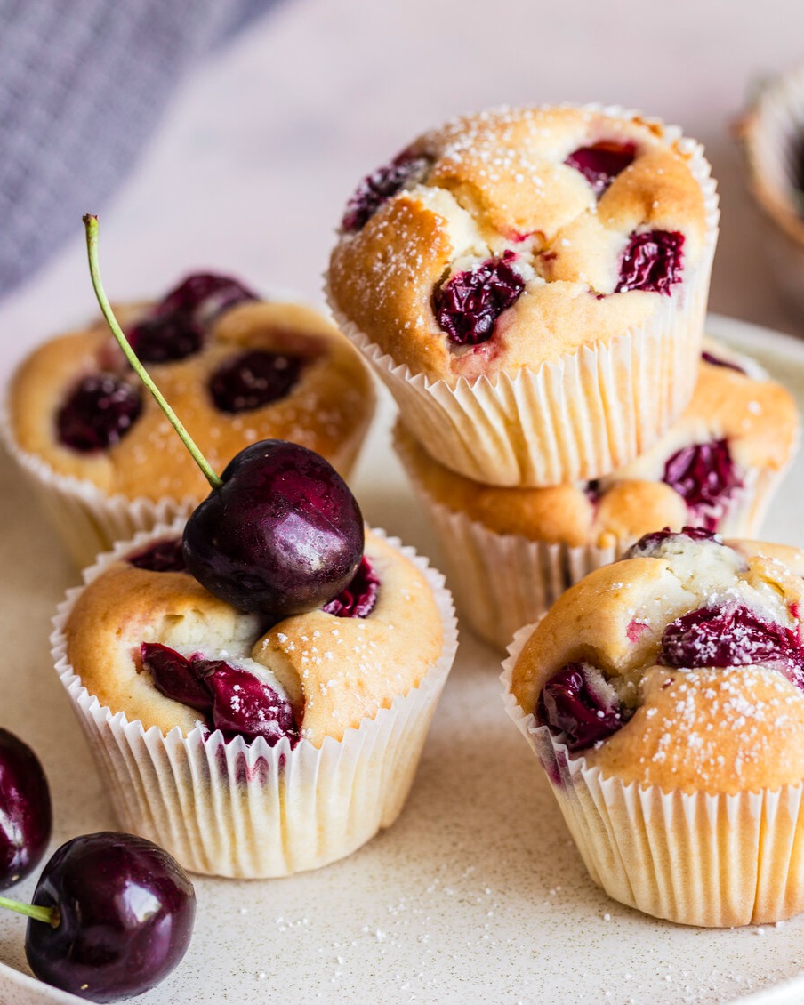 Fluffy Cherry Muffins with Powdered Sugar Dusting
