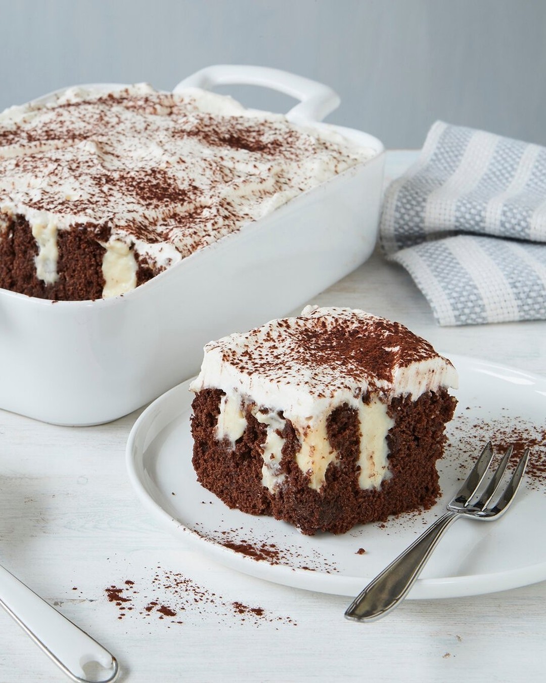 Moist Chocolate Poke Cake with Vanilla Pudding Filling