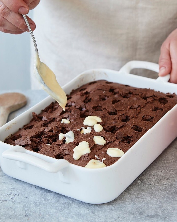 Moist Chocolate Poke Cake with Vanilla Pudding Filling