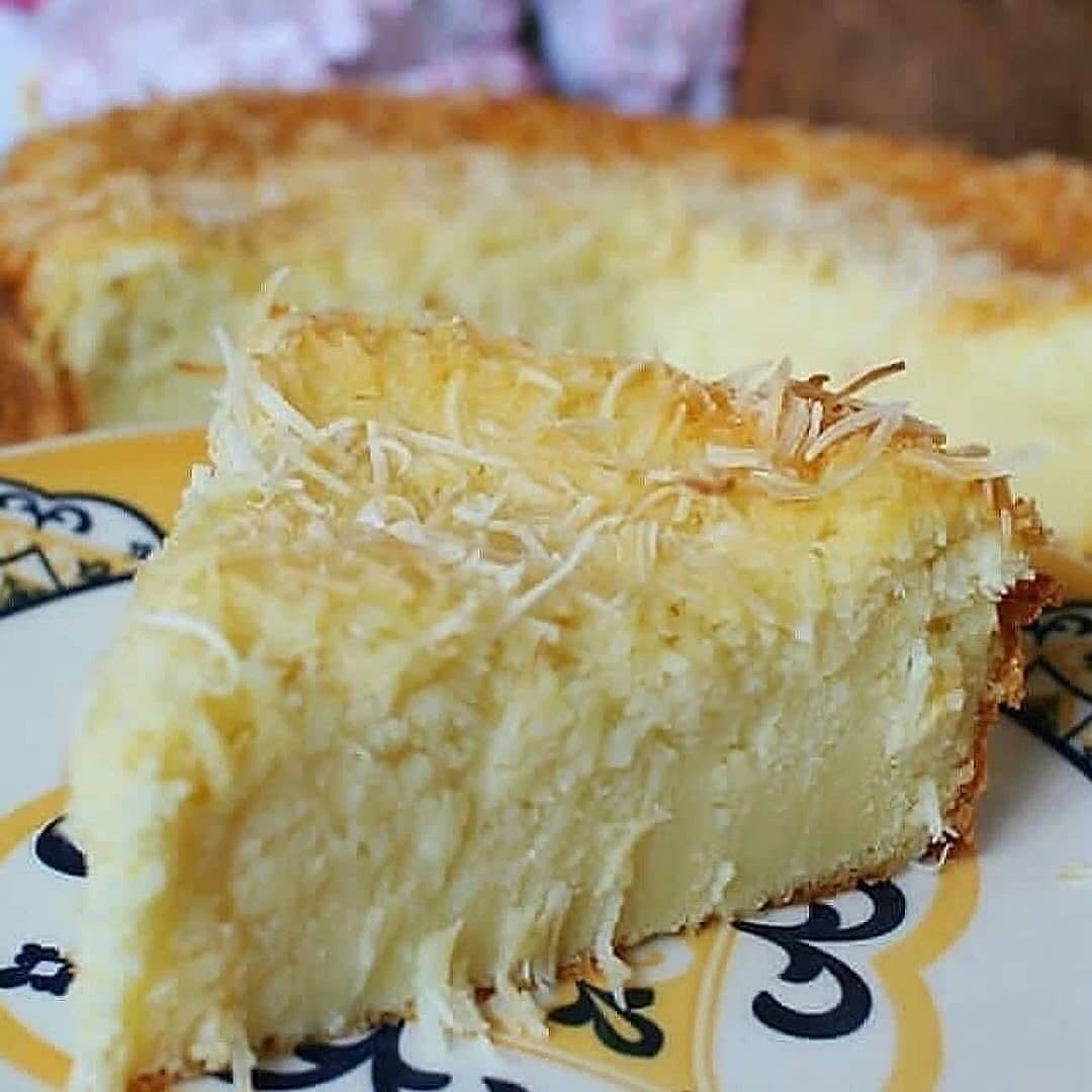 Creamy Coconut Cake with Golden Coconut Topping