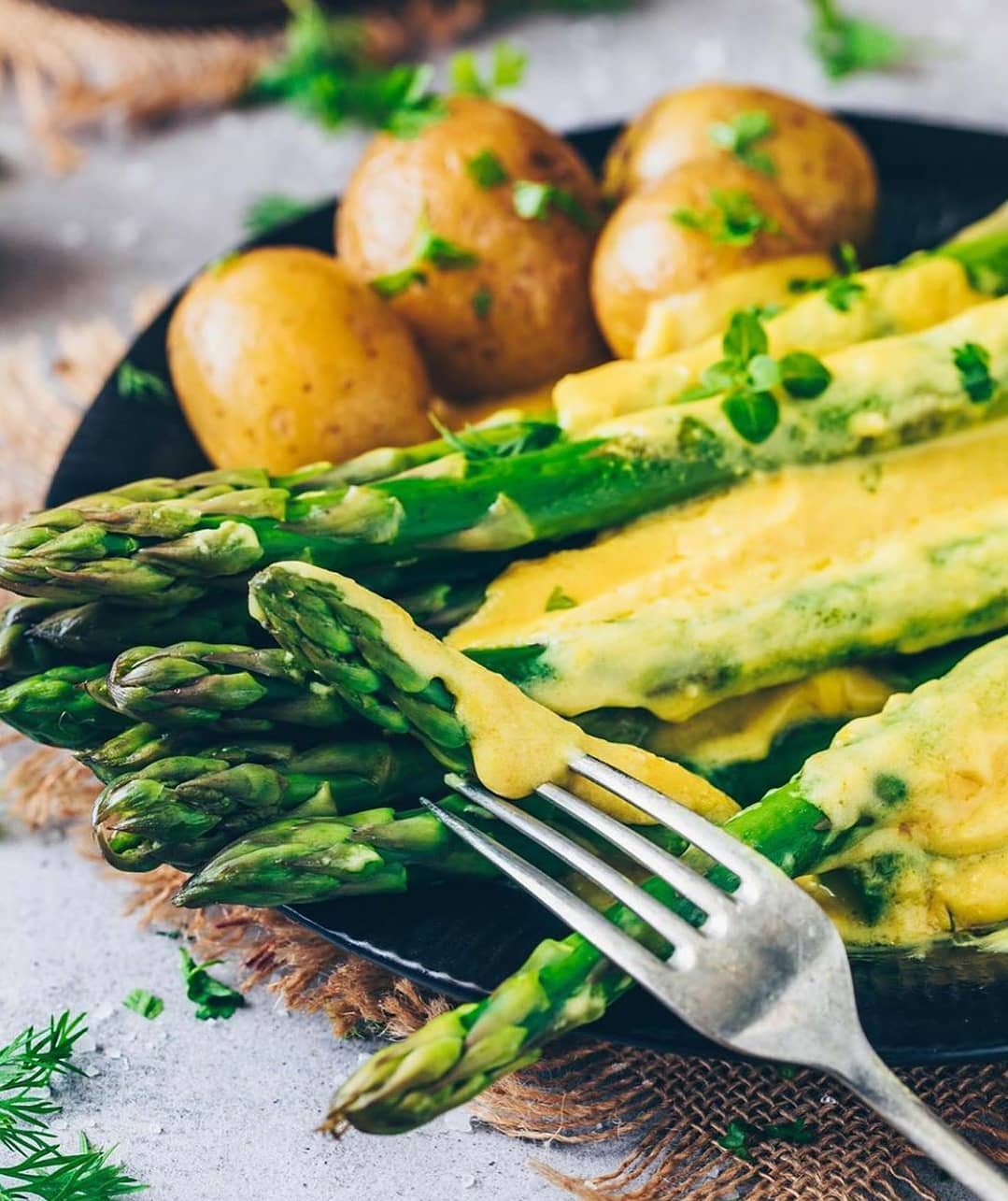 Vegan Hollandaise Sauce Served with Asparagus