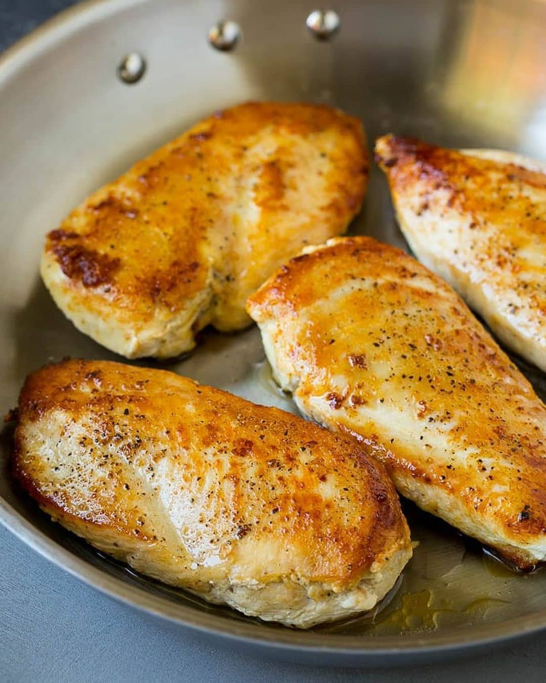 Golden Brown Chicken Breasts with Creamy Spinach Sauce