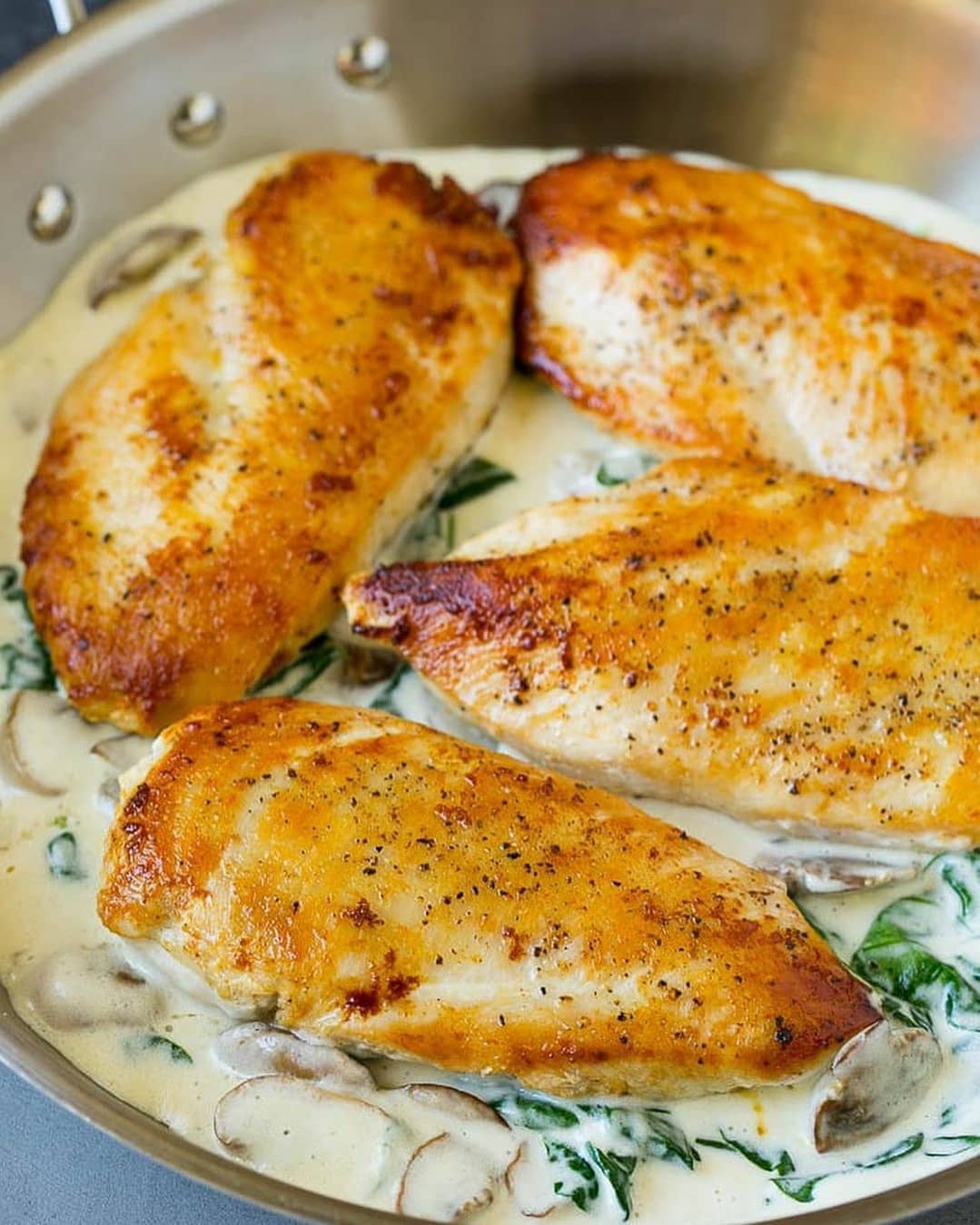 Golden Brown Chicken Breasts with Creamy Spinach Sauce