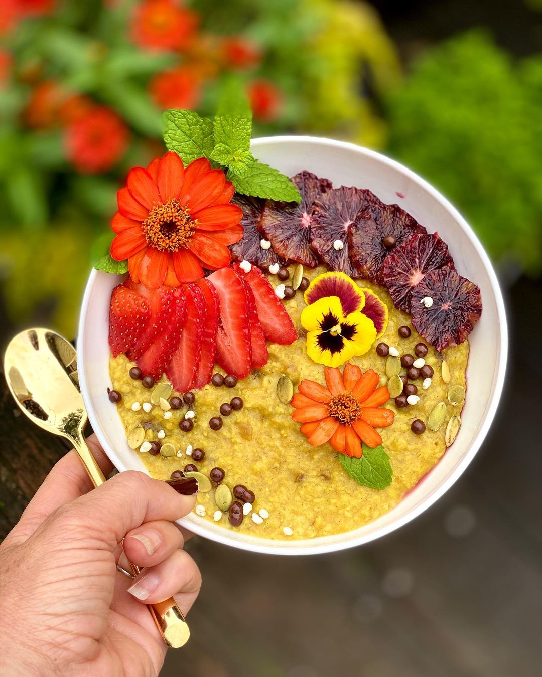 Cheerful Turmeric Oatmeal Bowl with Edible Flowers