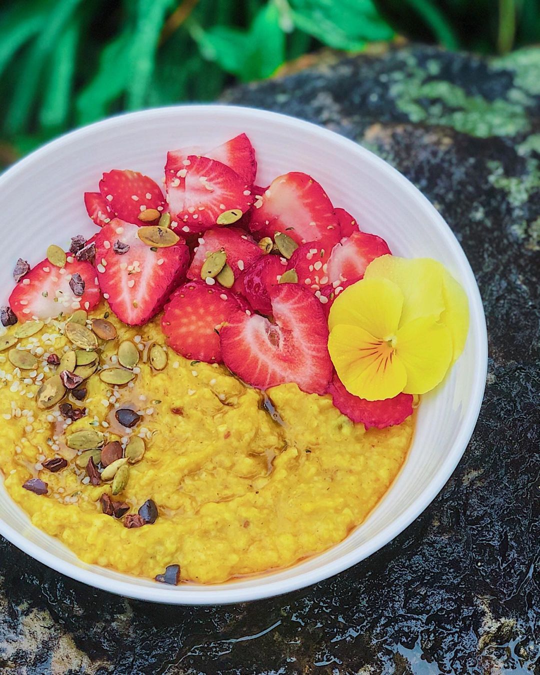 Turmeric Spiced Oatmeal with Fruit and Seed Toppings