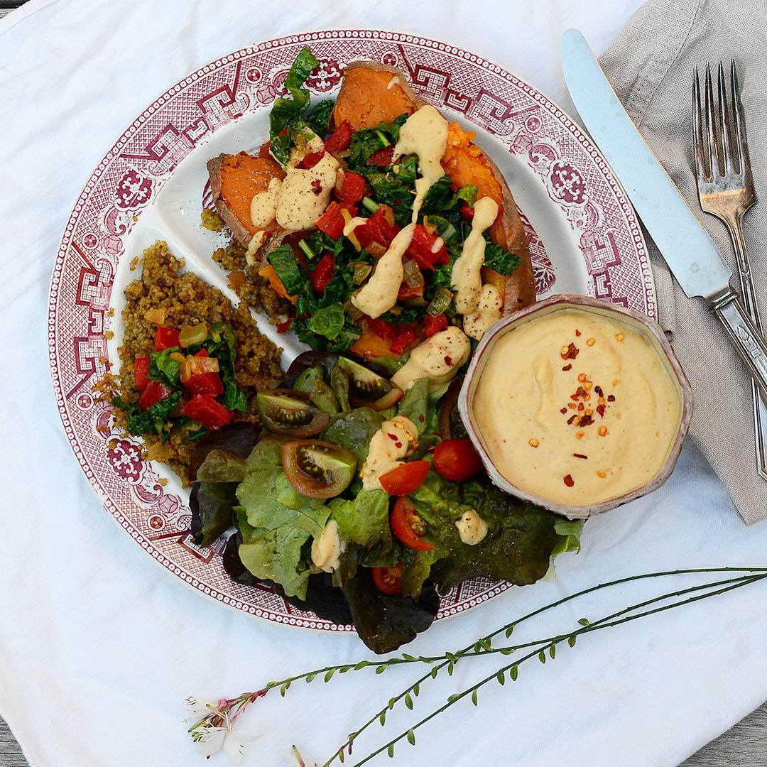 Loaded sweet potato with spicy zucchini and baobab garlic sauce