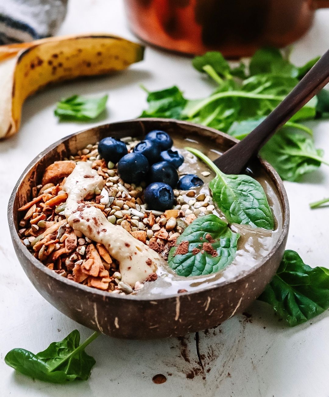 Spinach and Cacao Powder Smoothie Bowl with Lots of Deliciously Crunchy Granola