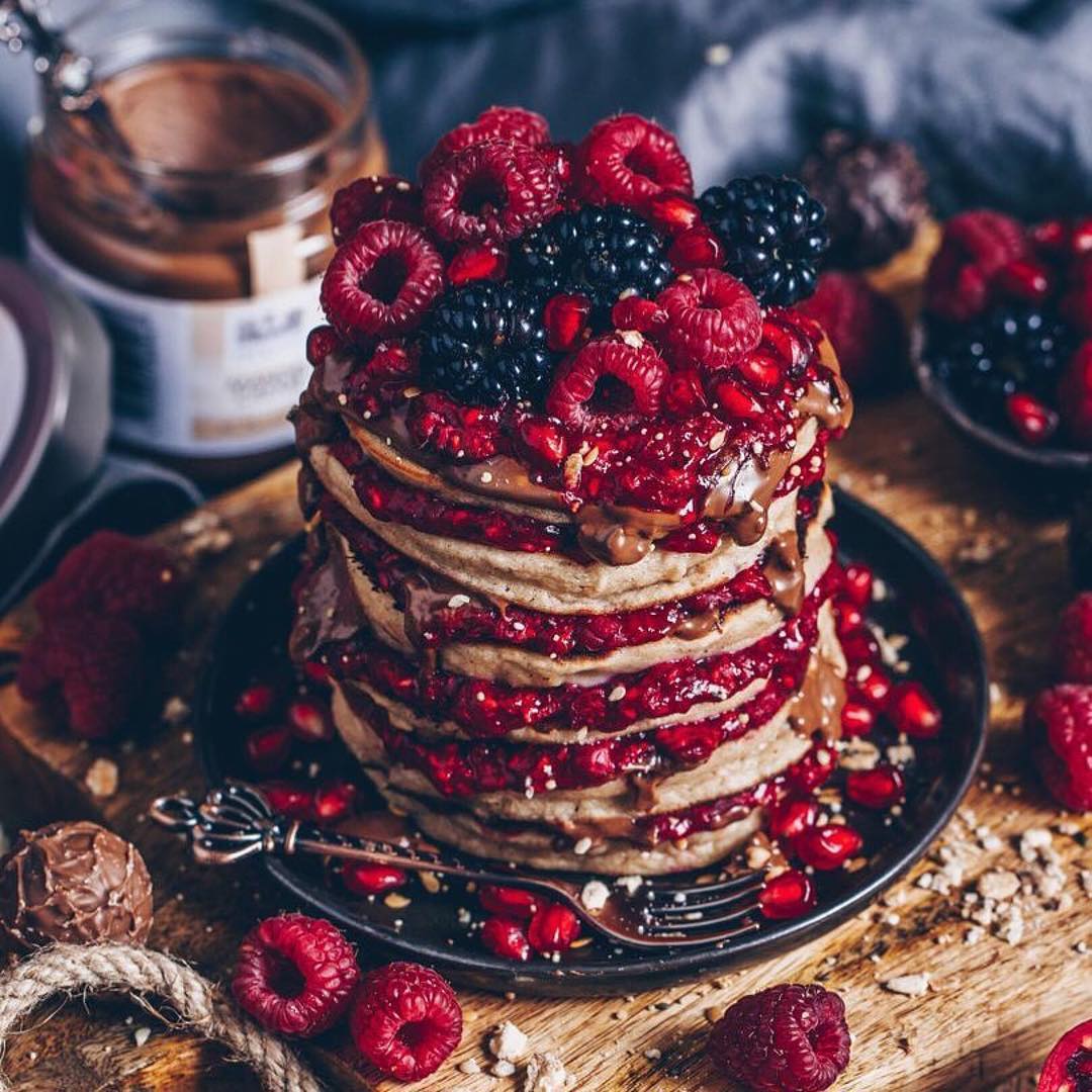 Almond Pancakes with warmed raspberries and almond cream