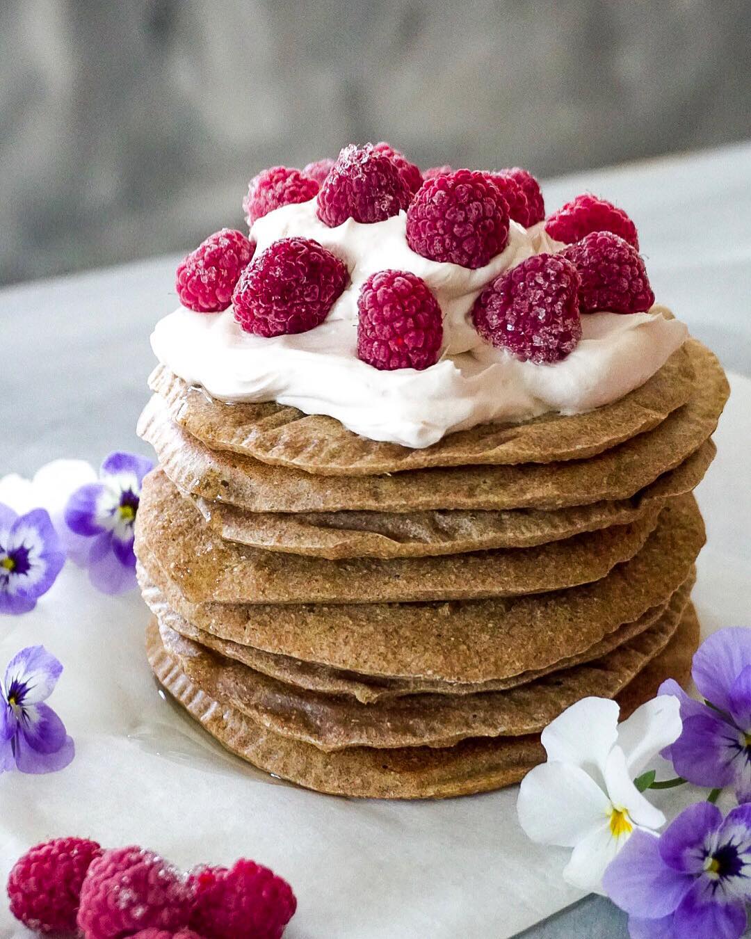 Delicious Banana Pancakes with Cream and Raspberries