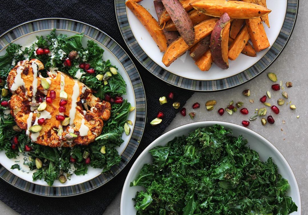 Spicy Harissa Cauliflower Steaks with Pistachios, Pomegranate, Kale, and Sweet Potato