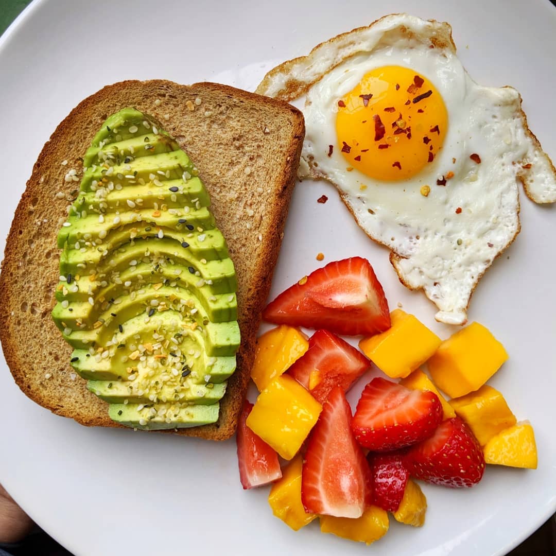 Avocado Toast with Fried Egg and Fresh Fruits